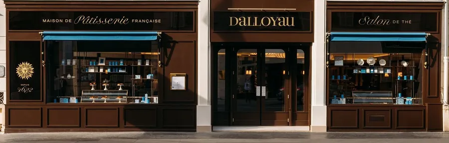 Dalloyau shopfront at 101 rue du Faubourg-Saint-Honoré in dark brown wood with blue awnings, the tea salon on the right, photo by Dalloyau