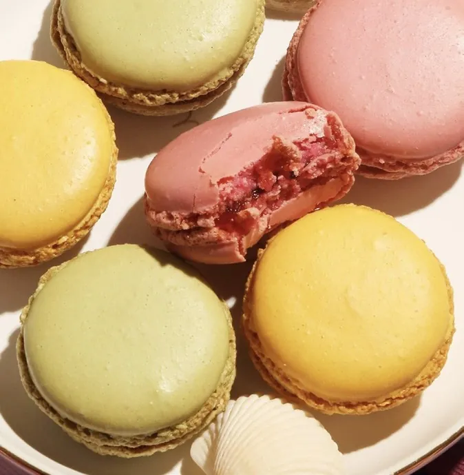 Pastel macarons in pink, yellow and pistachio green, photo by Fauchon