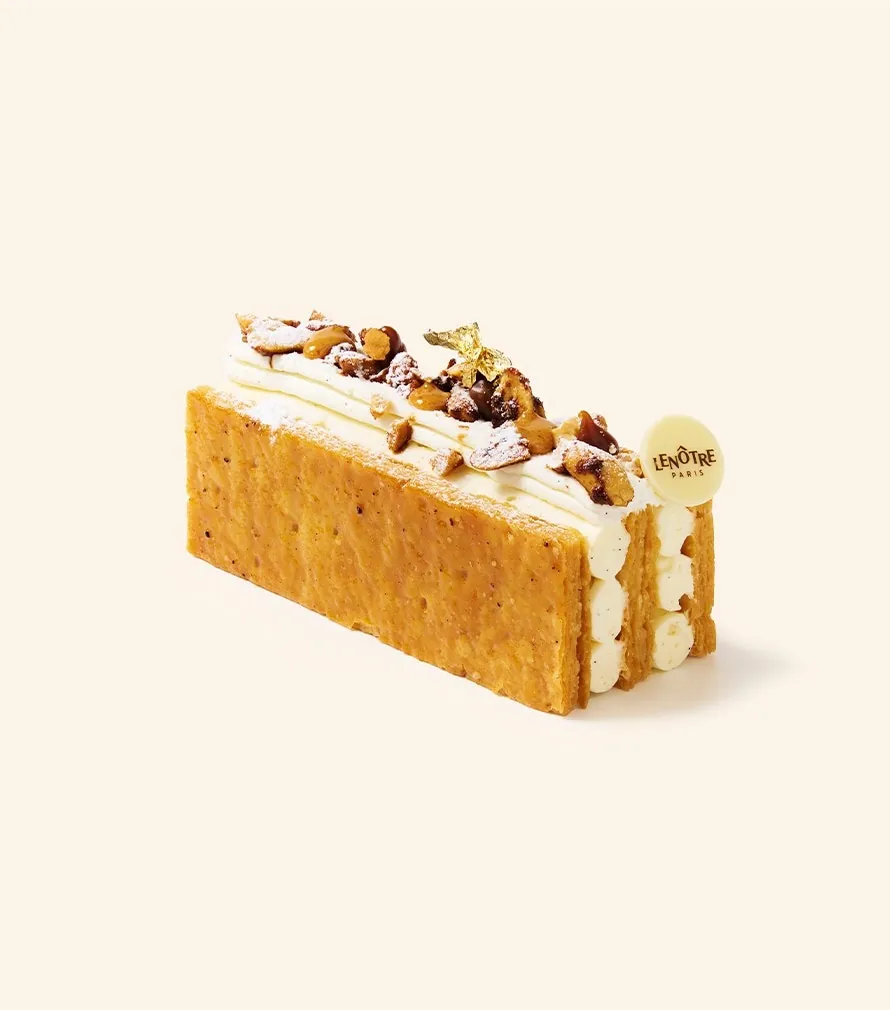 Lenôtre peanut millefeuille with piped vanilla cream, caramelised peanuts and a flake of gold leaf, photo by Lenôtre